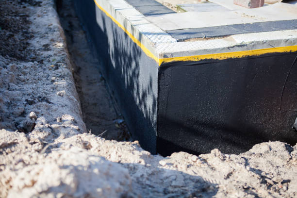 Professional Waterproofing technician working in Reston, VA